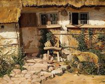 Outside a whitewashed house with a thatch roof - Frederik Vermehren